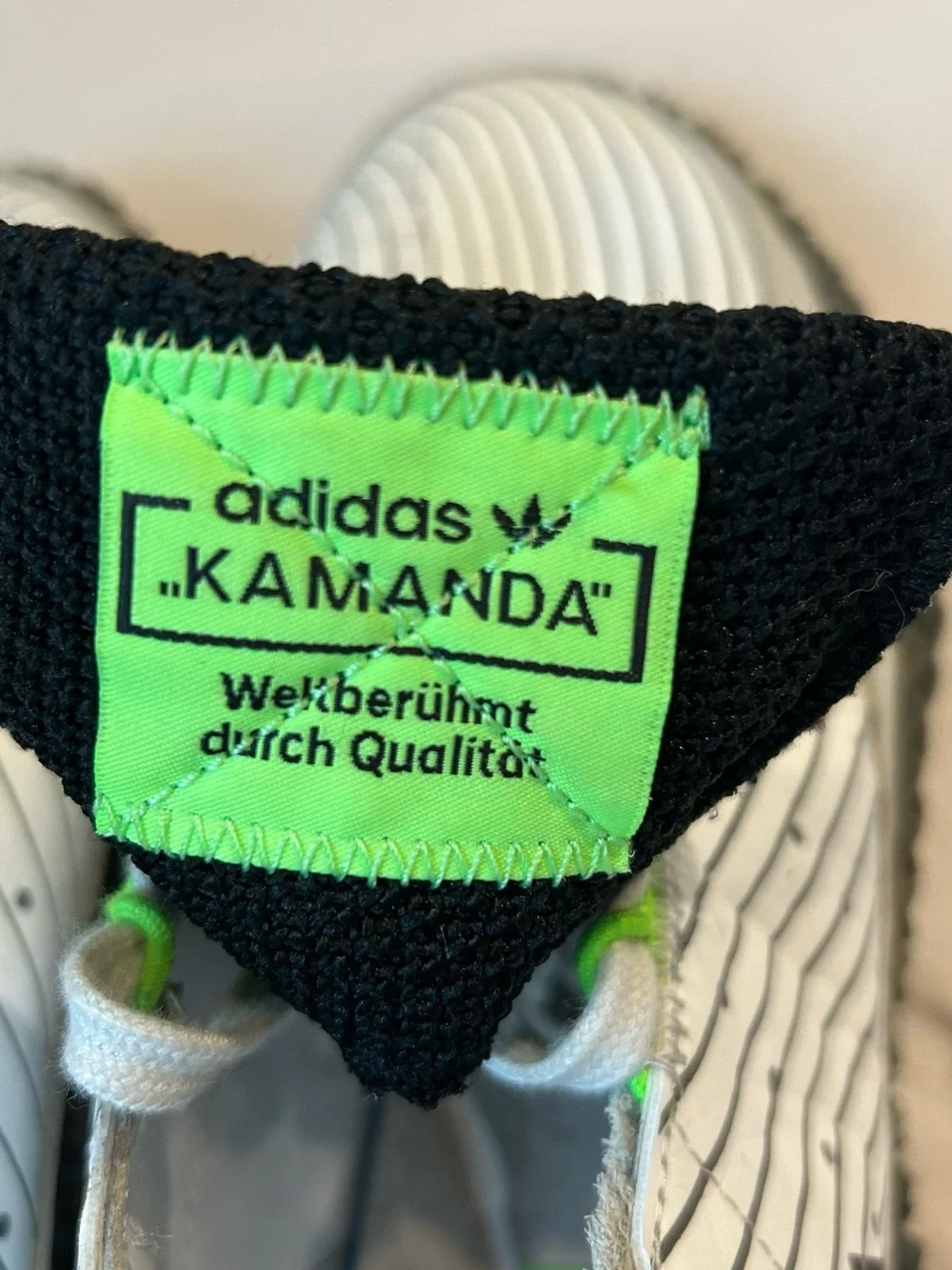 adidas mens Kamanda White Sneakers with Black and Neon Green Accents